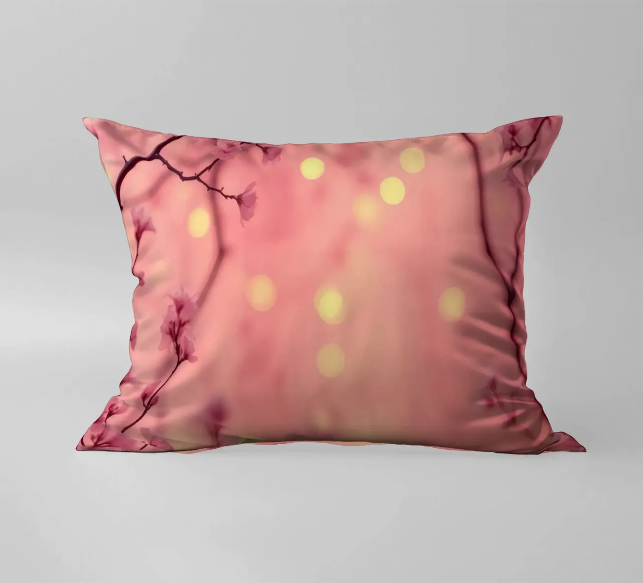 Delicate pink blossoms set against a dreamy bokeh background decorative cushion by DesignDoodle