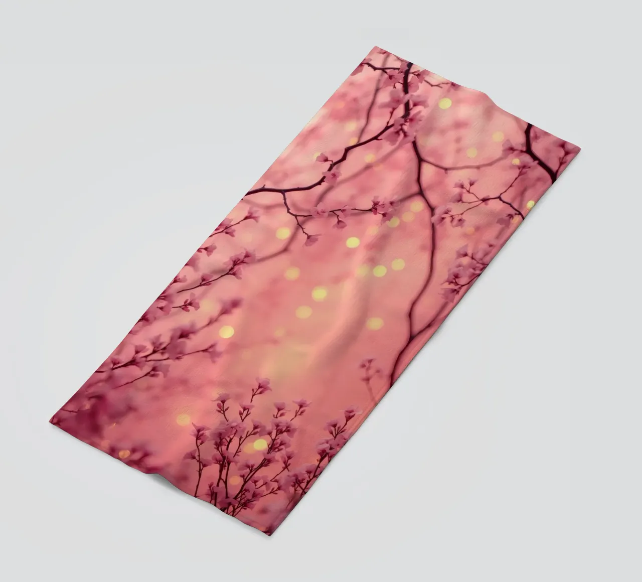 Delicate pink blossoms set against a dreamy bokeh background beach towel by DesignDoodle