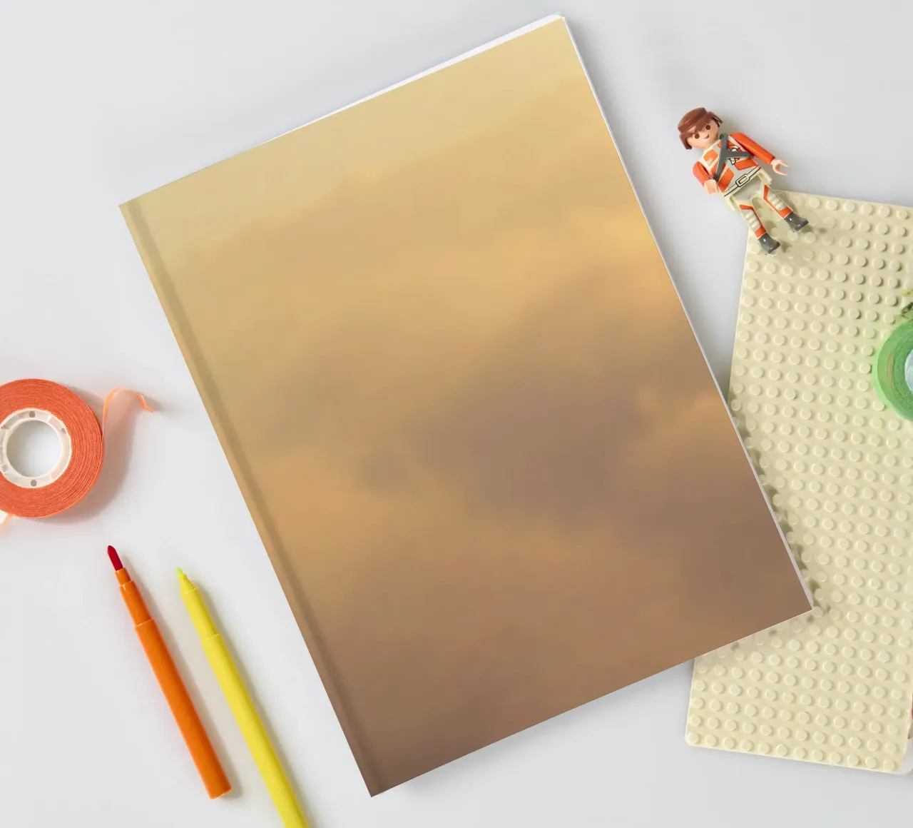 Soft clouds drifting in a golden sky notebook by DesignDoodle