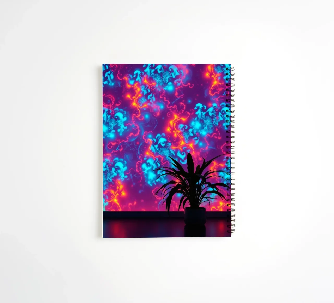 glowing patterns with a silhouette of a potted plant spiral notebook by DesignDoodle
