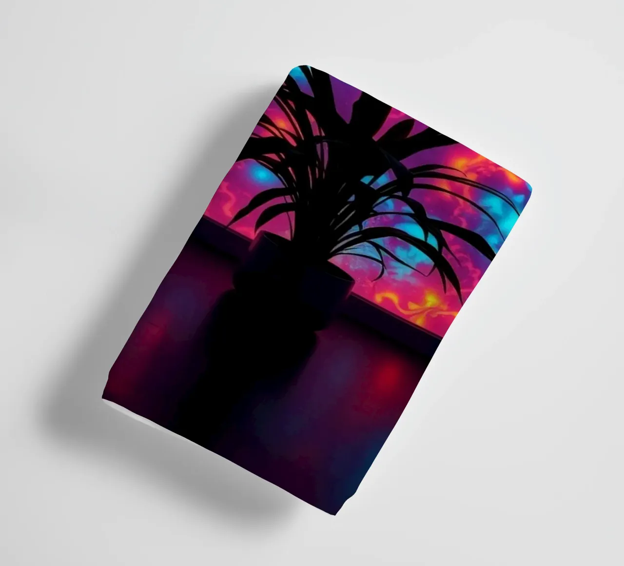 glowing patterns with a silhouette of a potted plant towel by DesignDoodle