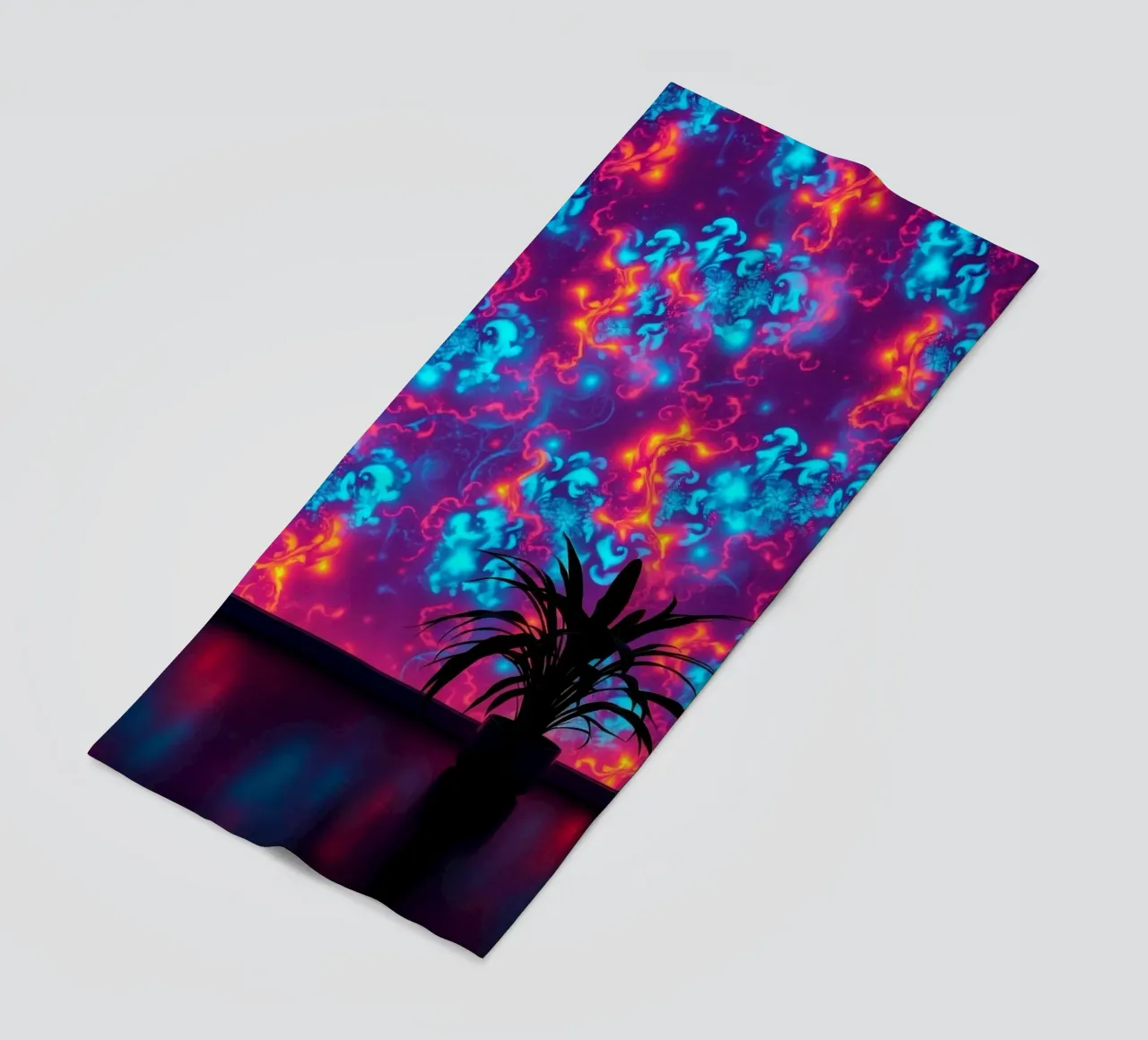 glowing patterns with a silhouette of a potted plant beach towel by DesignDoodle