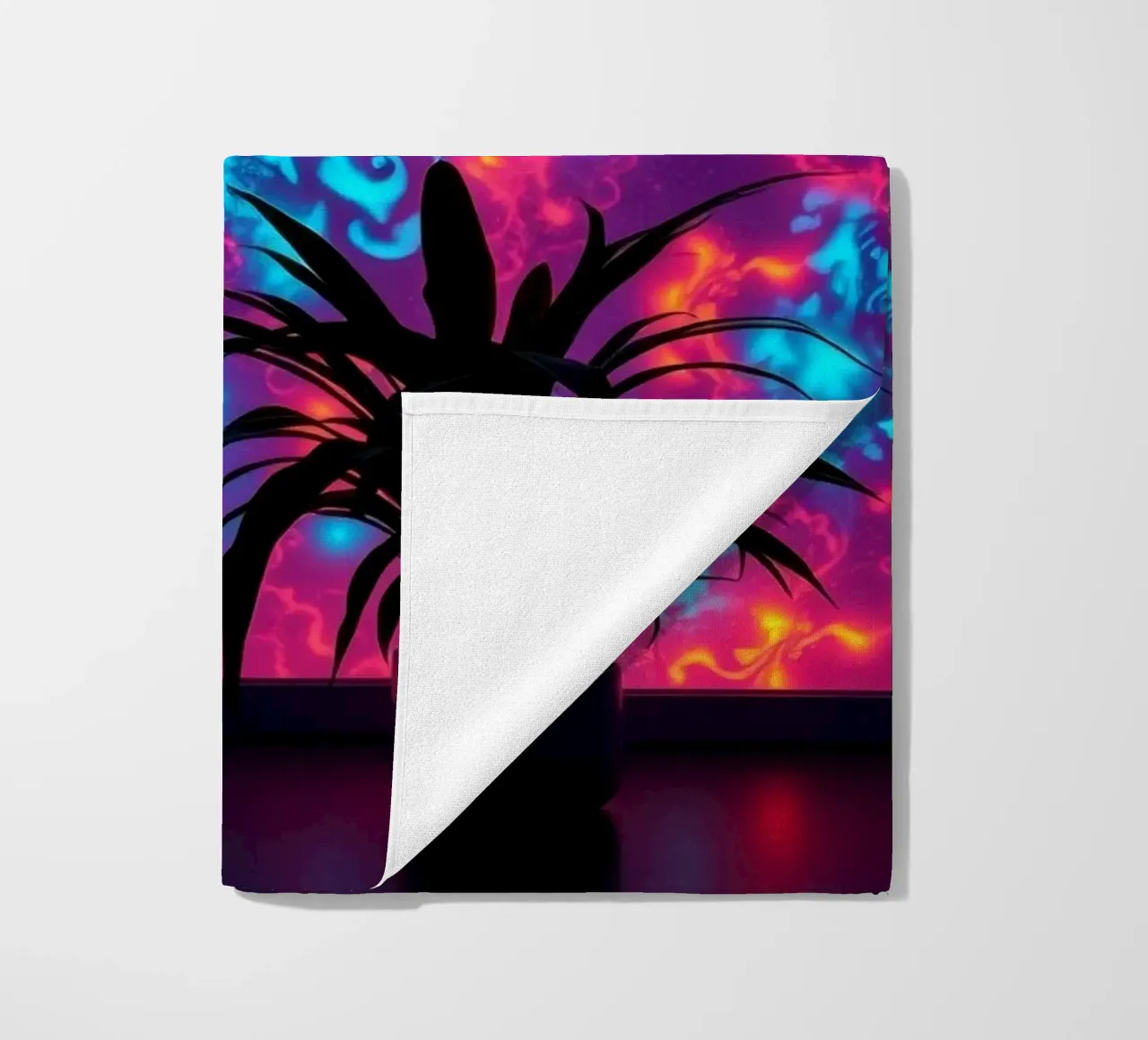 glowing patterns with a silhouette of a potted plant beach towel by DesignDoodle