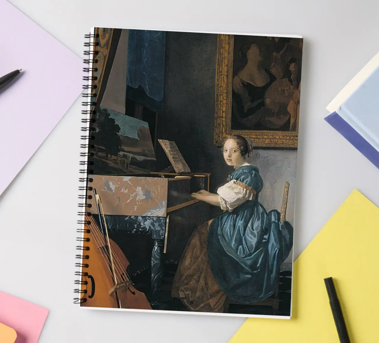 vermeer - woman sitting in front of a keyboard spiral notebook by The Dinda