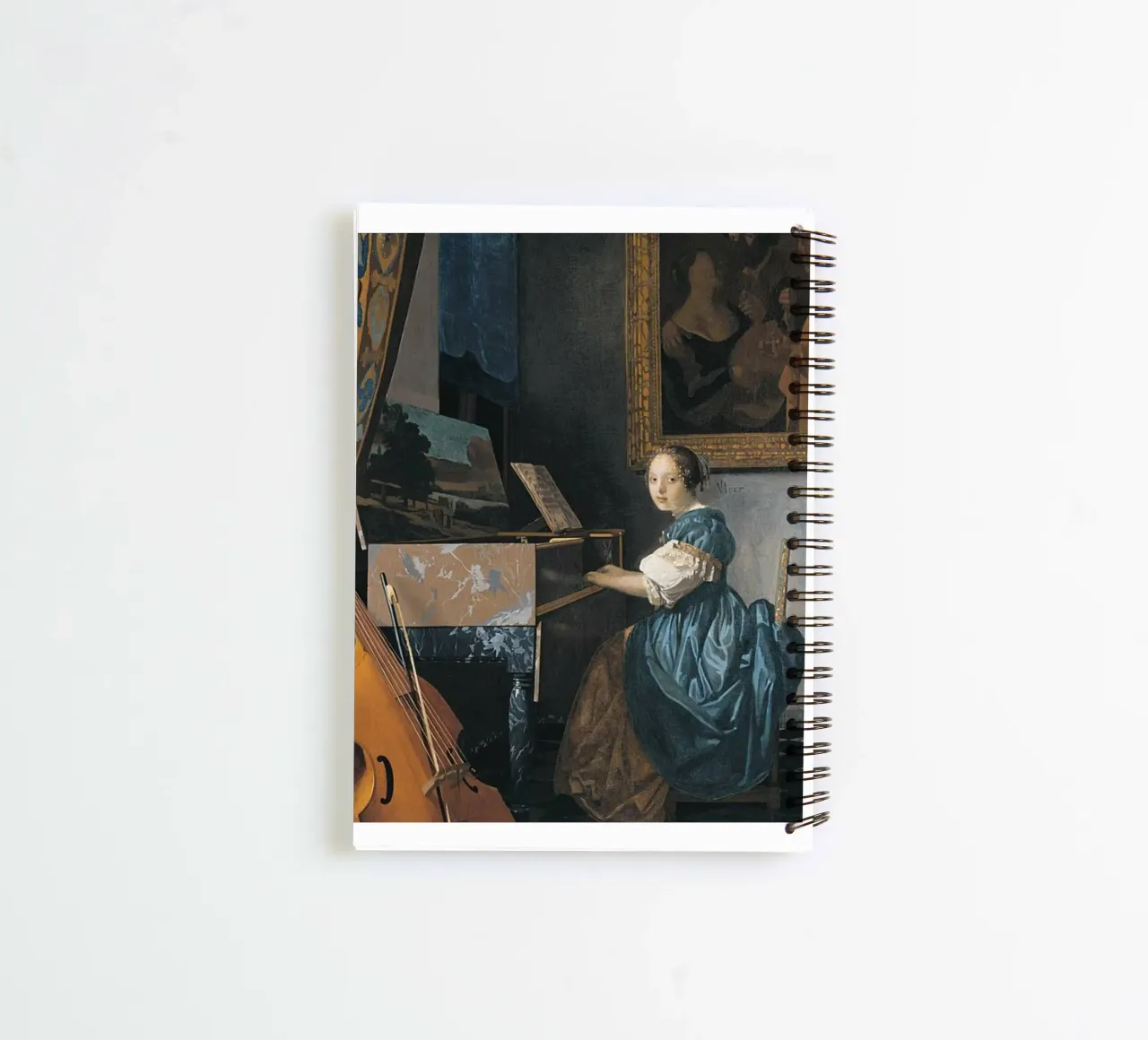 vermeer - woman sitting in front of a keyboard spiral notebook by The Dinda