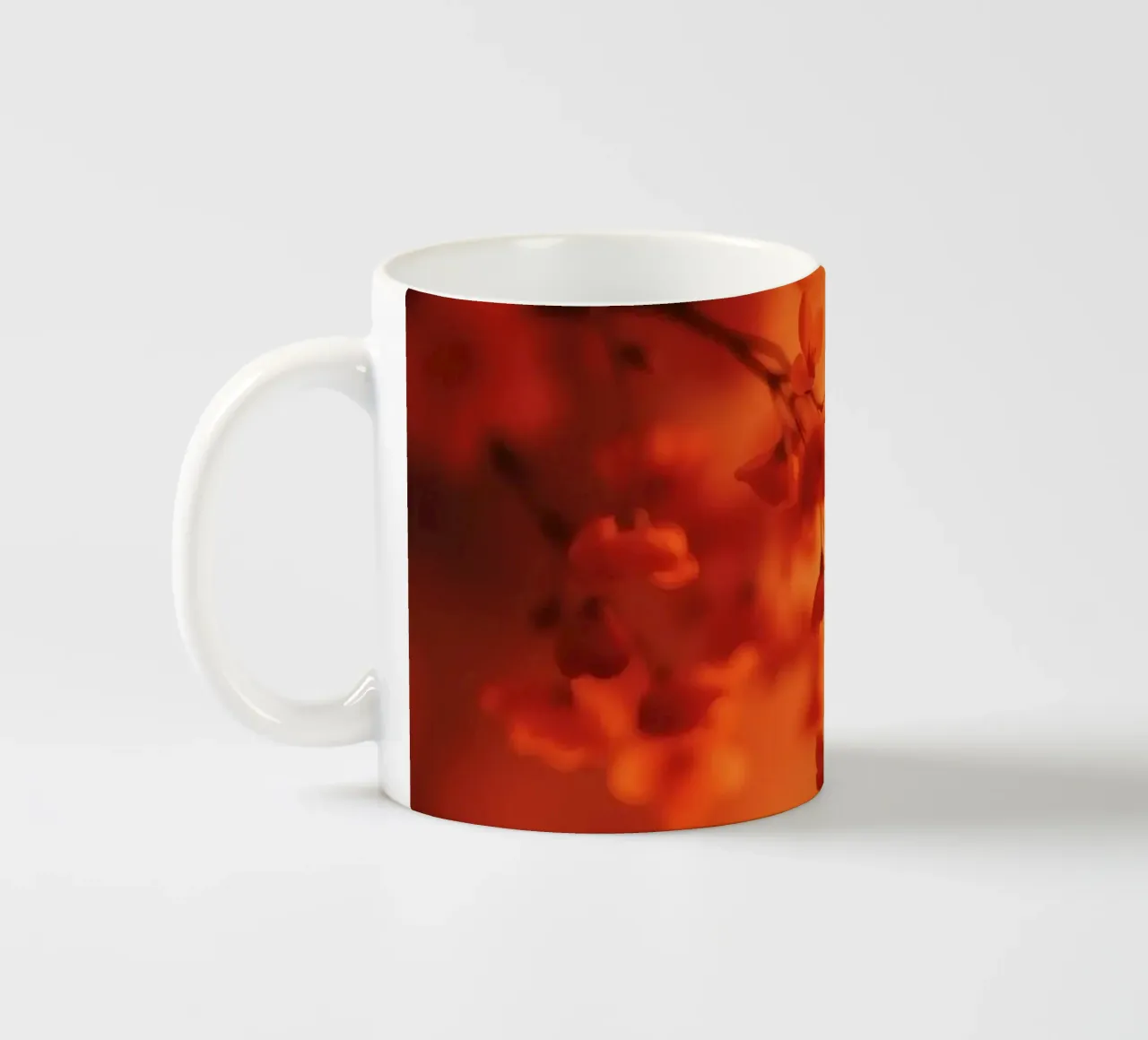 sfondo floreale arancione con soft focus tazza in ceramica da DesignDoodle