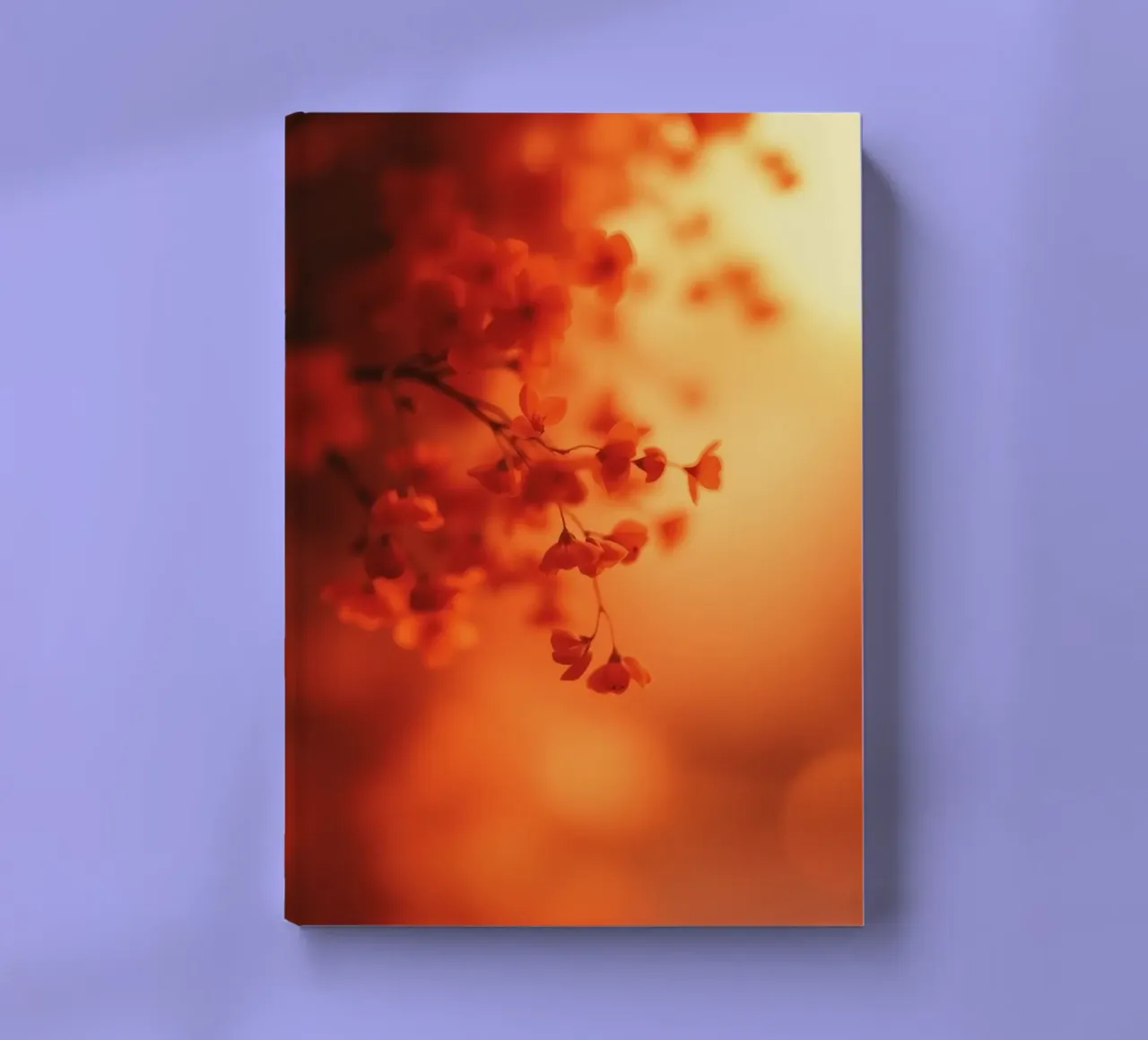 orange floral background with soft focus notebook by DesignDoodle