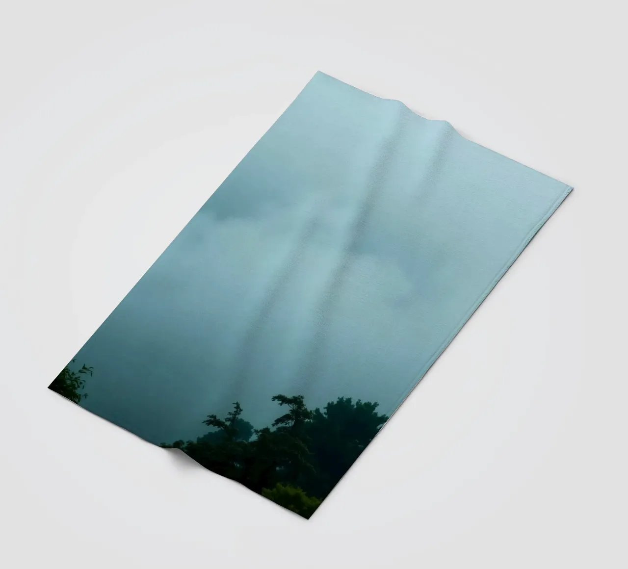 Foggy landscape with trees, creating calming atmosphere fleece blanket by DesignDoodle