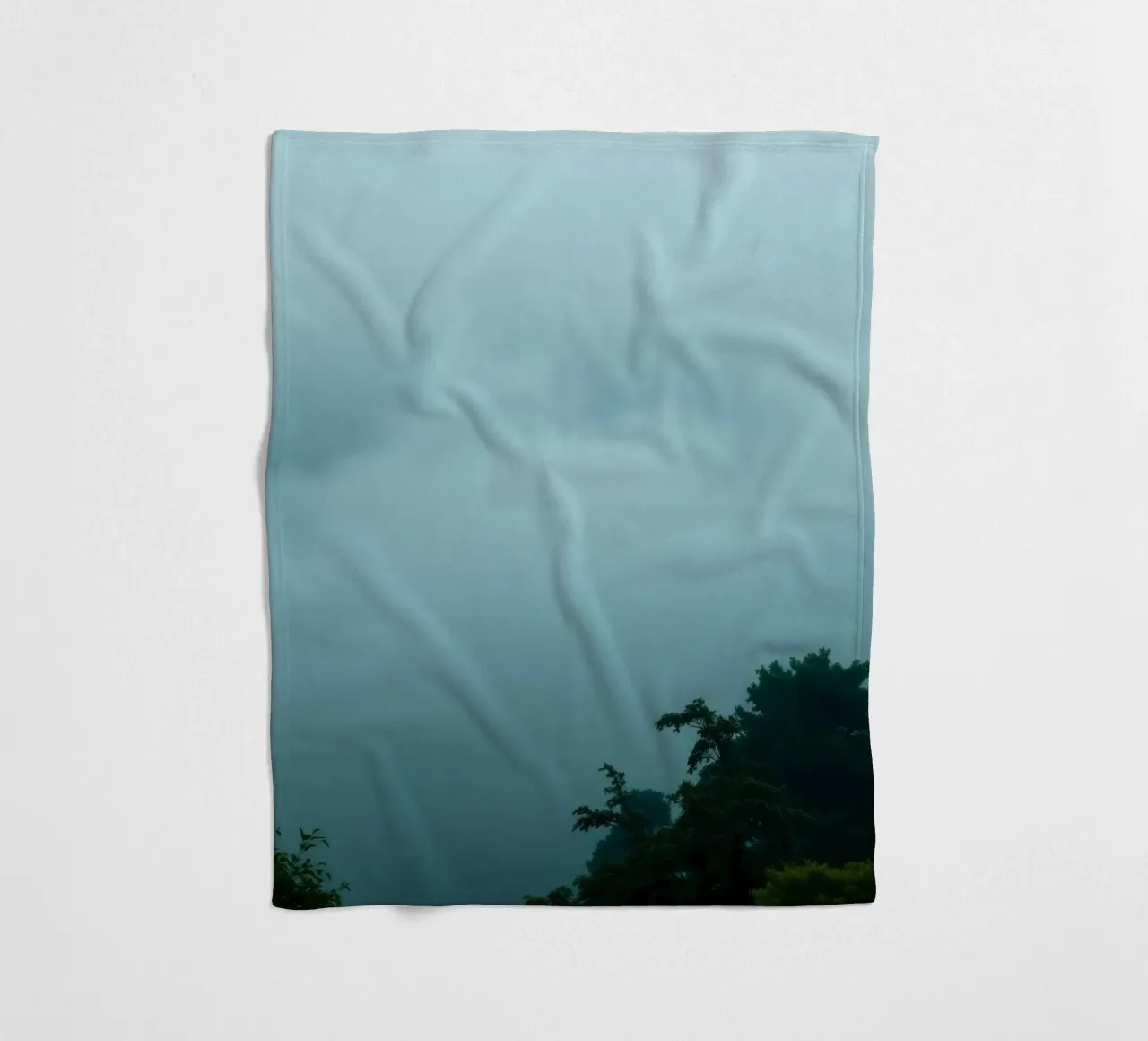 Foggy landscape with trees, creating calming atmosphere fleece blanket by DesignDoodle
