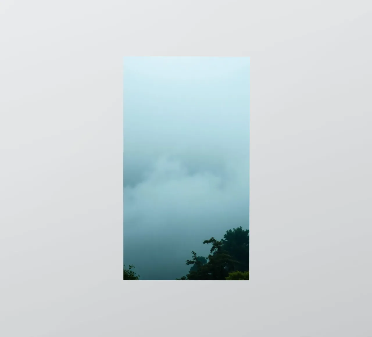 Foggy landscape with trees, creating calming atmosphere sticker by DesignDoodle