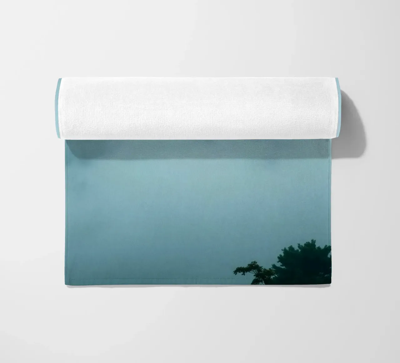 Foggy landscape with trees, creating calming atmosphere beach towel by DesignDoodle