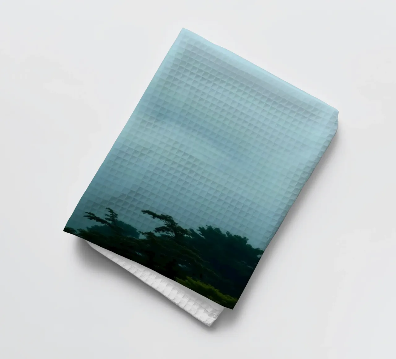 Foggy landscape with trees, creating calming atmosphere tea towel by DesignDoodle