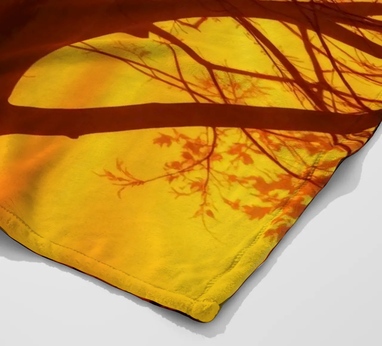 silhouette of a tree against a vibrant orange background wit fleece blanket by DesignDoodle