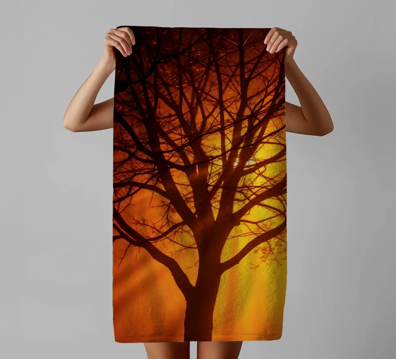 silhouette of a tree against a vibrant orange background wit towel by DesignDoodle