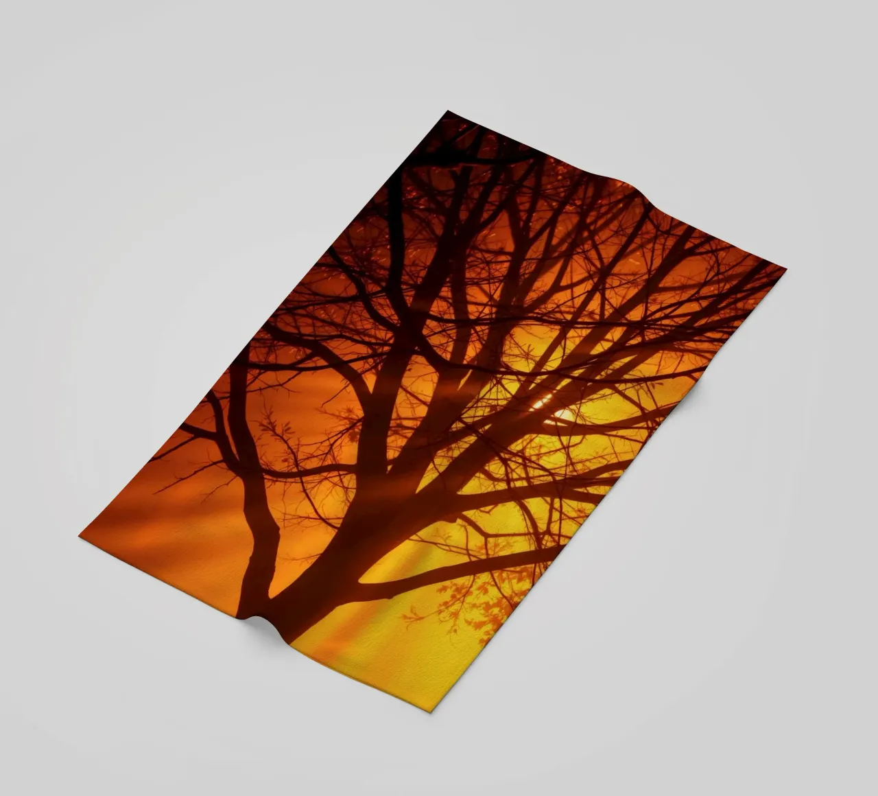 silhouette of a tree against a vibrant orange background wit beach towel by DesignDoodle
