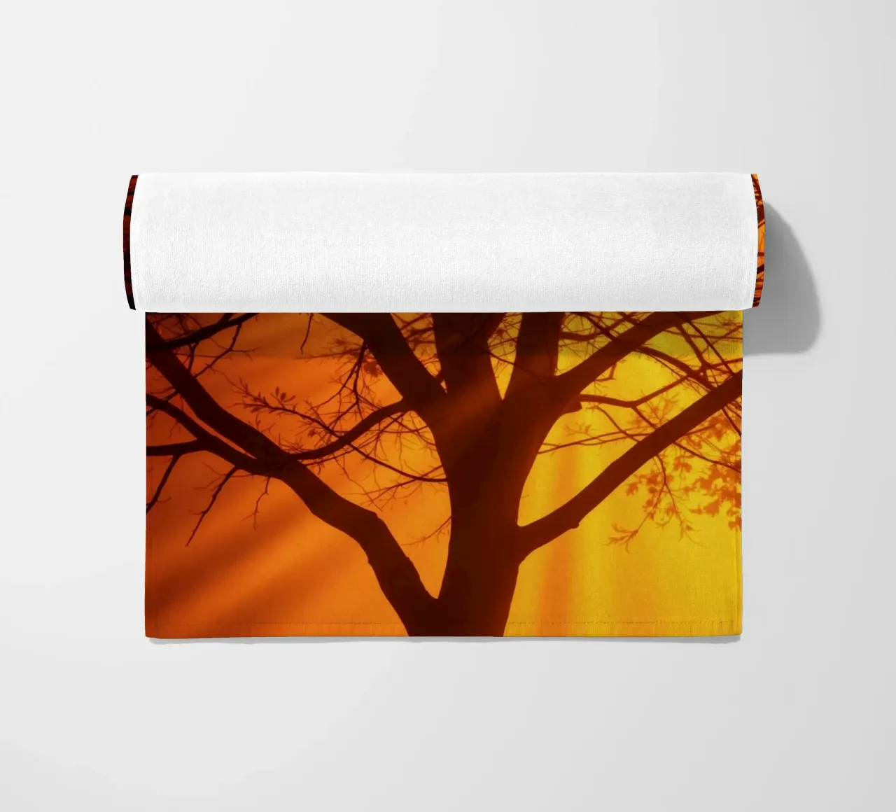 silhouette of a tree against a vibrant orange background wit beach towel by DesignDoodle