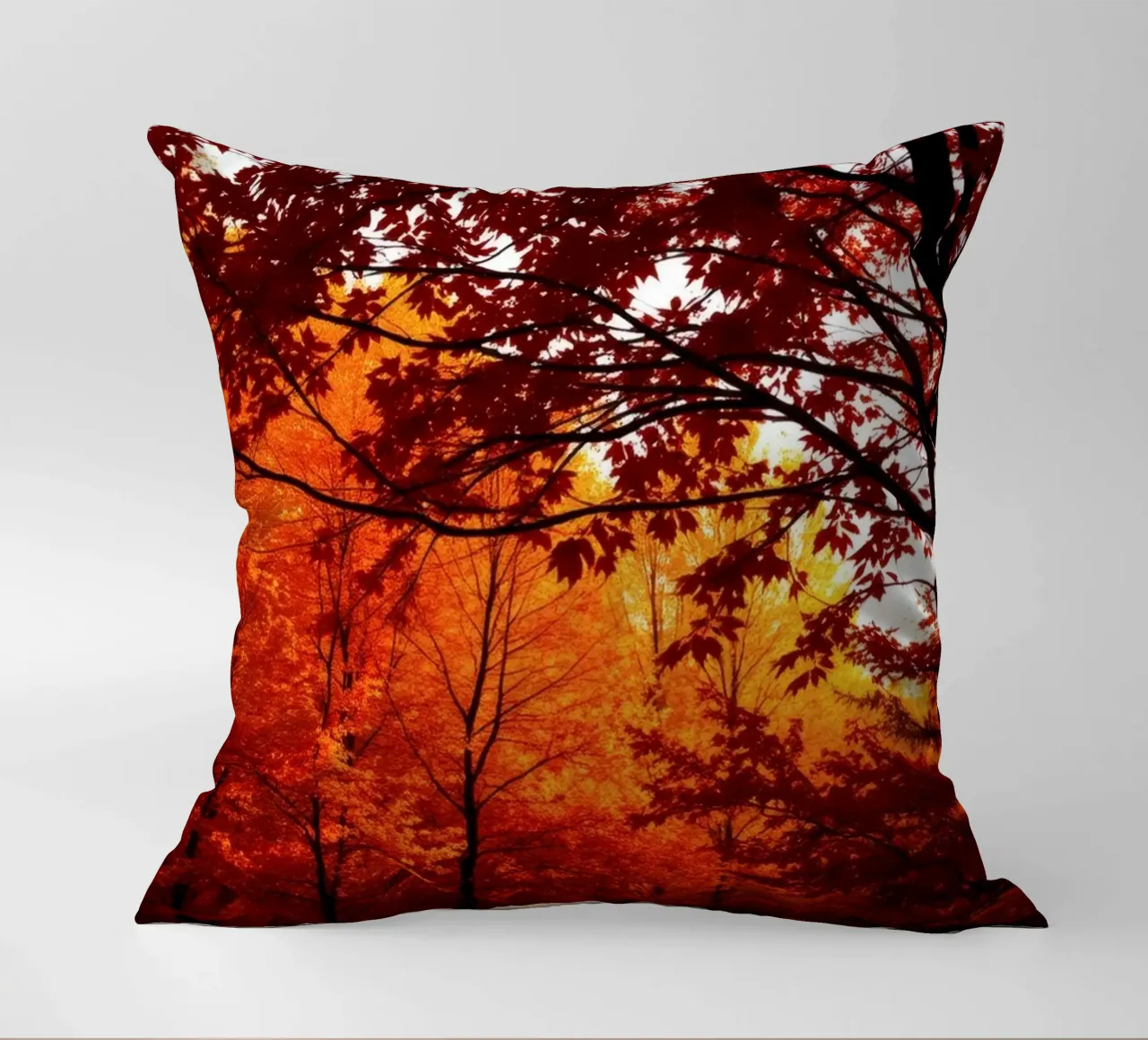 autumn foliage creating vibrant tapestry of reds and orange decorative cushion by DesignDoodle