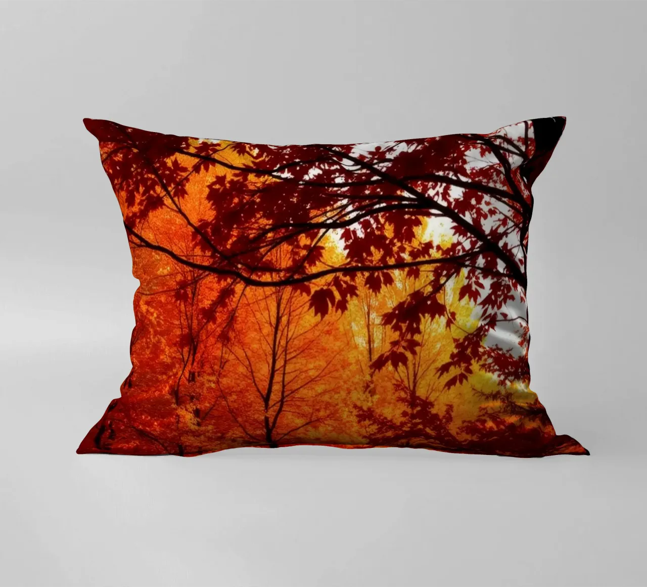 autumn foliage creating vibrant tapestry of reds and orange decorative cushion by DesignDoodle