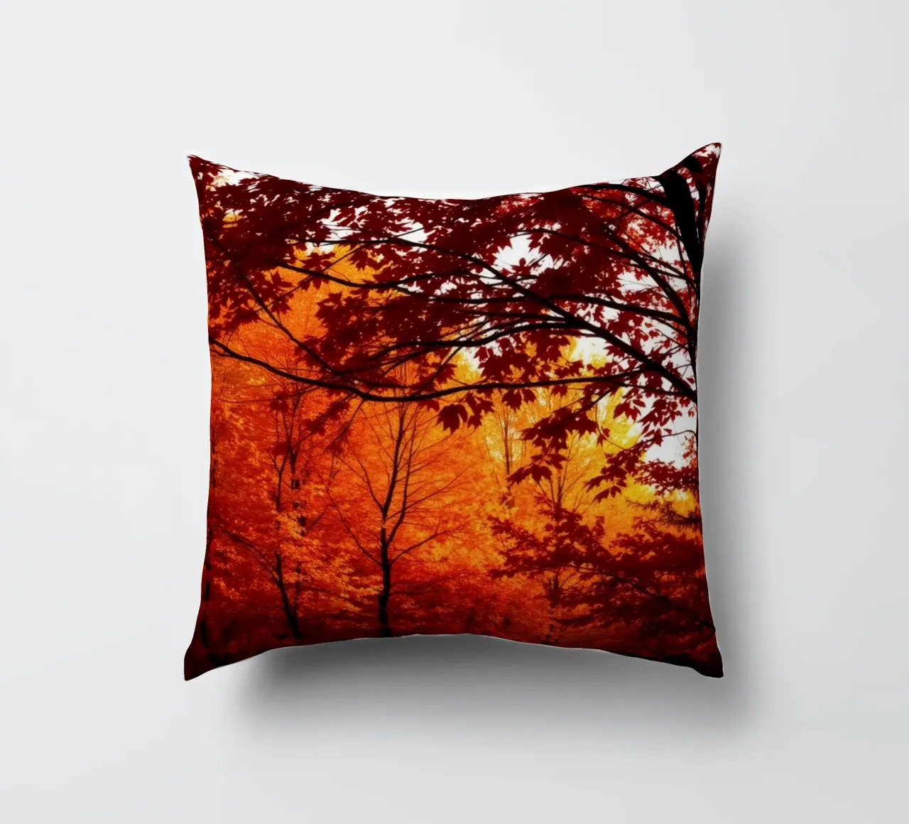 autumn foliage creating vibrant tapestry of reds and orange decorative cushion by DesignDoodle