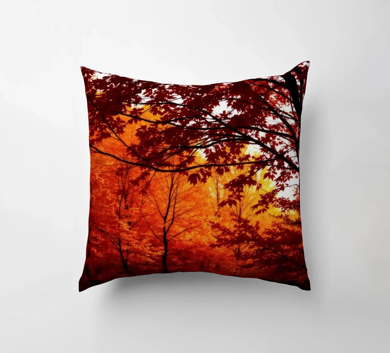autumn foliage creating vibrant tapestry of reds and orange decorative cushion by DesignDoodle