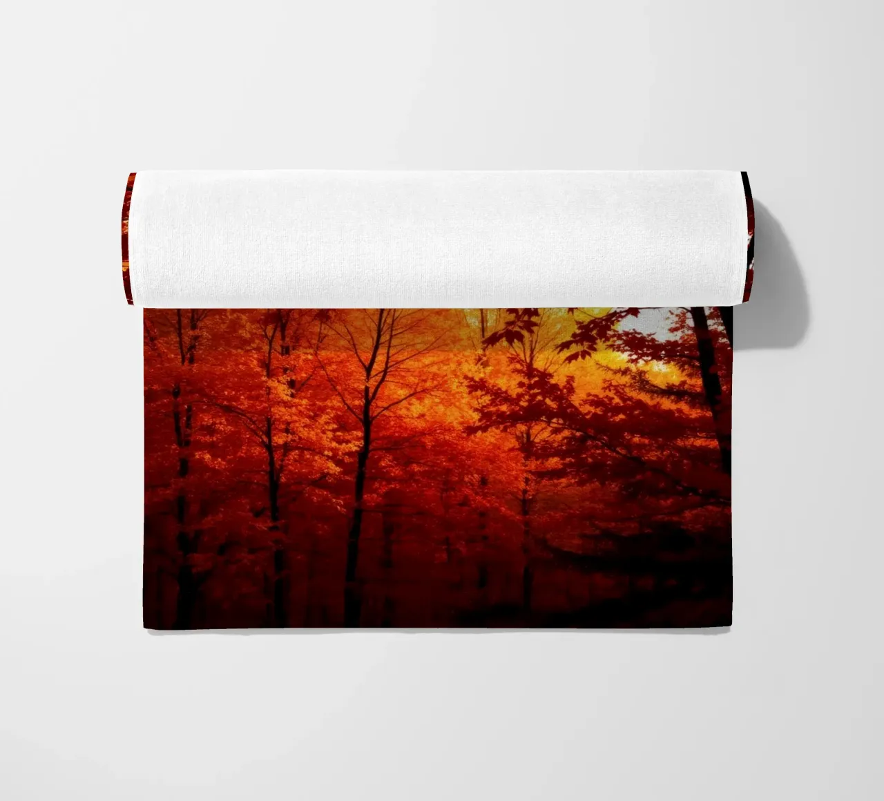 autumn foliage creating vibrant tapestry of reds and orange beach towel by DesignDoodle