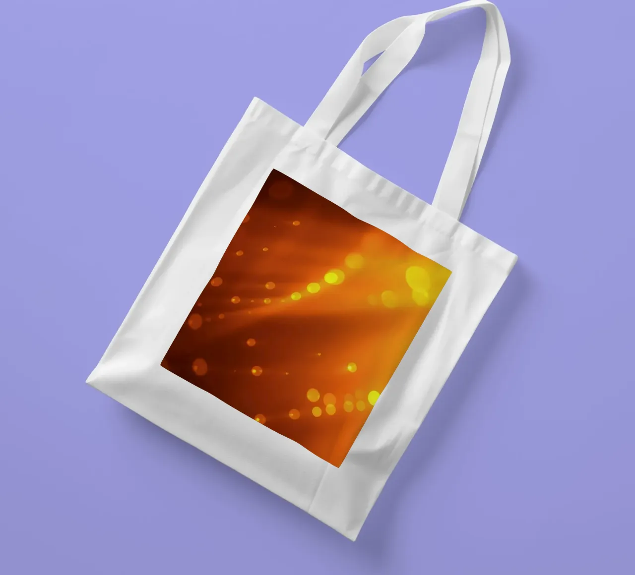 raggi di luce arancione incandescente ed effetti bokeh borsa in juta da DesignDoodle