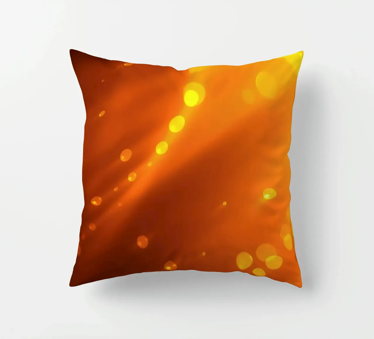 raggi di luce arancione incandescente ed effetti bokeh cuscino da DesignDoodle