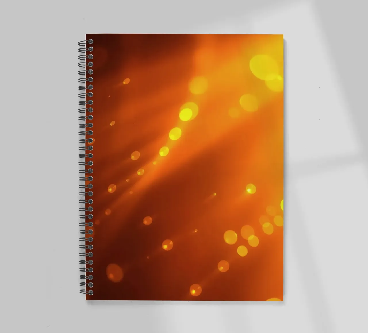 glowing orange light rays and bokeh effects spiral notebook by DesignDoodle