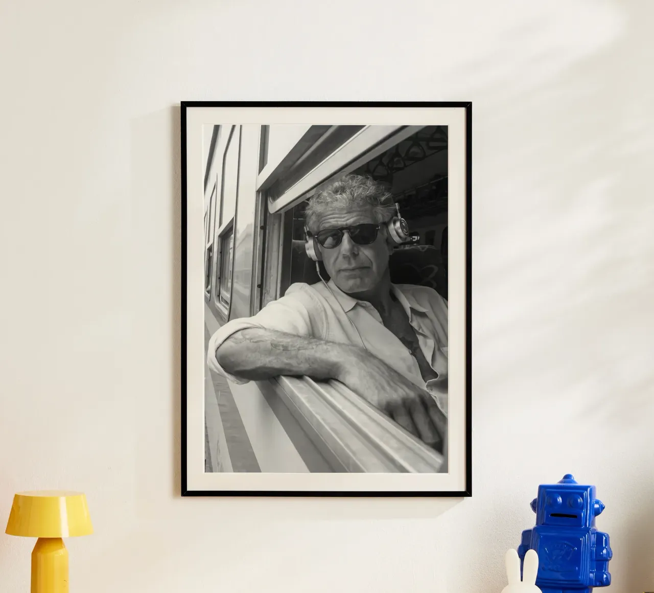 Anthony Bourdain Listening To Music in the Train poster by Beth Pop Culture