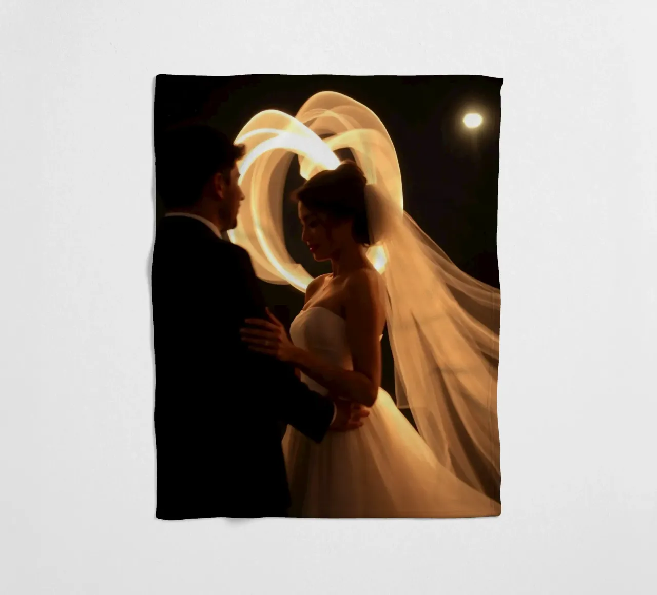 Couple shares a romantic moment with glowing veil fleece blanket by DesignDoodle