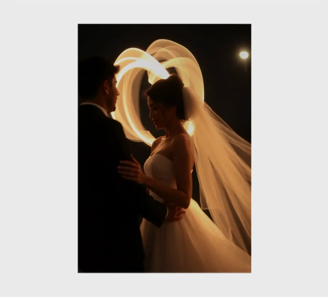 Couple shares a romantic moment with glowing veil notebook by DesignDoodle
