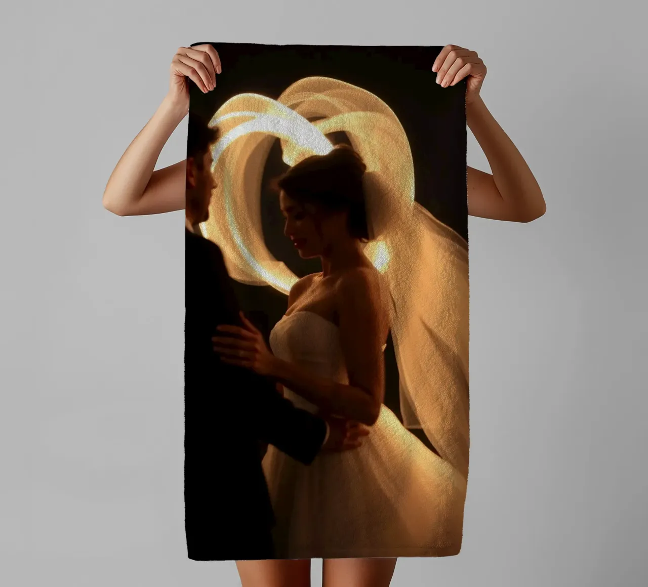 Couple shares a romantic moment with glowing veil towel by DesignDoodle