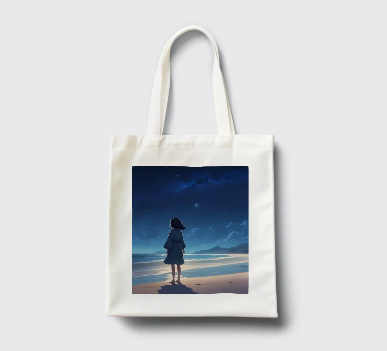 Une jeune fille regarde le ciel étoilé depuis une plage de sable. tote bag de DesignDoodle