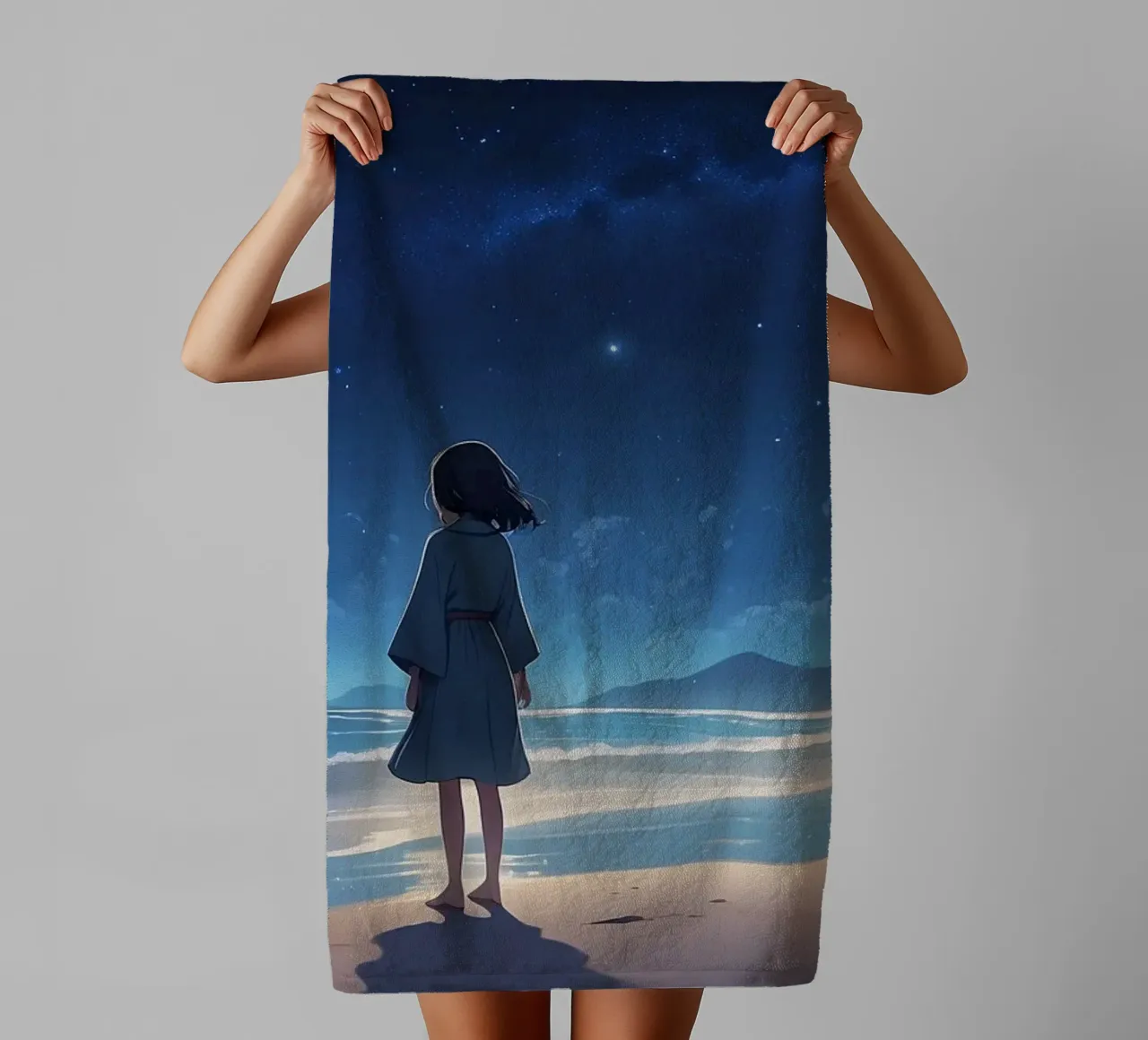 Une jeune fille regarde le ciel étoilé depuis une plage de sable. serviette de bain de DesignDoodle