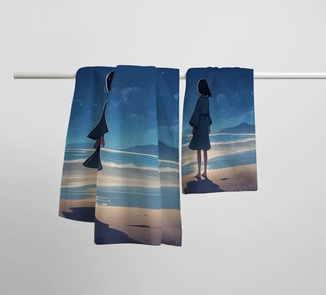 Une jeune fille regarde le ciel étoilé depuis une plage de sable. serviette de bain de DesignDoodle