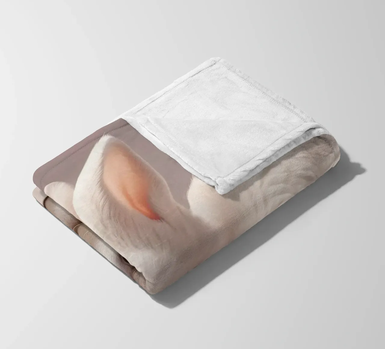 White rabbit resting among soft pink flowers fleece blanket by DesignDoodle