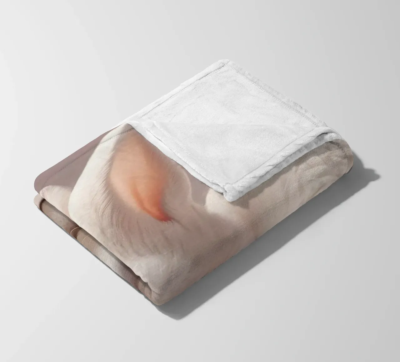 White rabbit resting among soft pink flowers fleece blanket by DesignDoodle