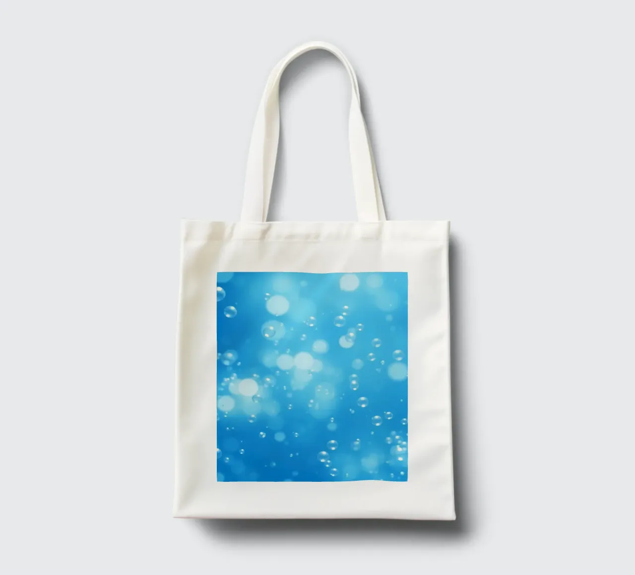 Bubbles floating in clear blue water creating calm art tote bag by DesignDoodle