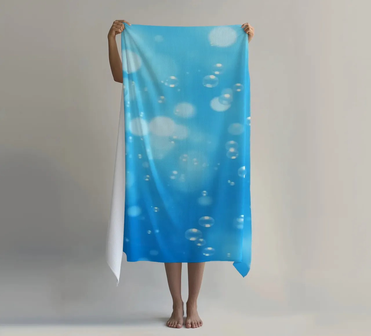 Bubbles floating in clear blue water creating calm art beach towel by DesignDoodle
