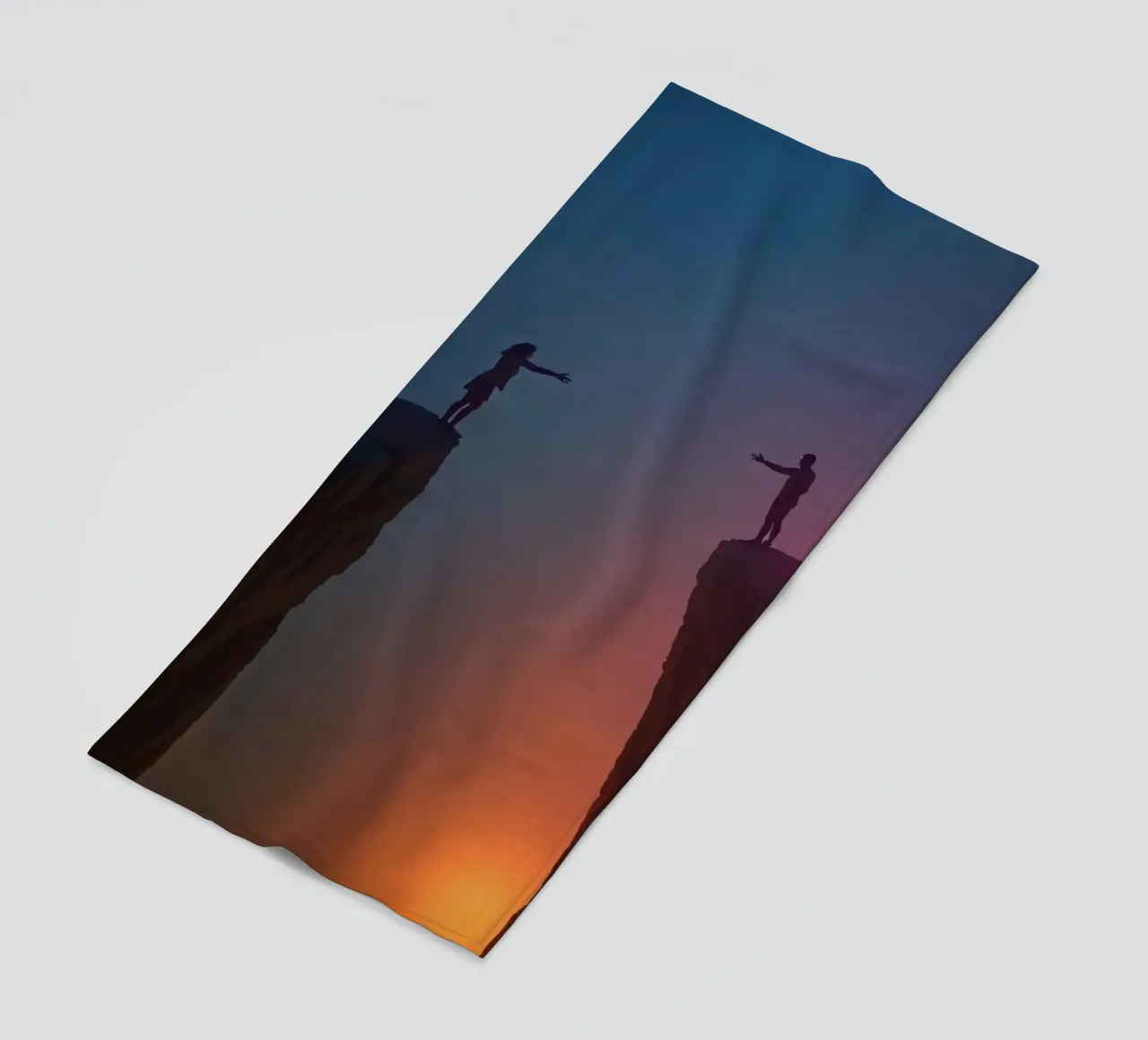 Two people reaching out to each other across a chasm beach towel by DesignDoodle