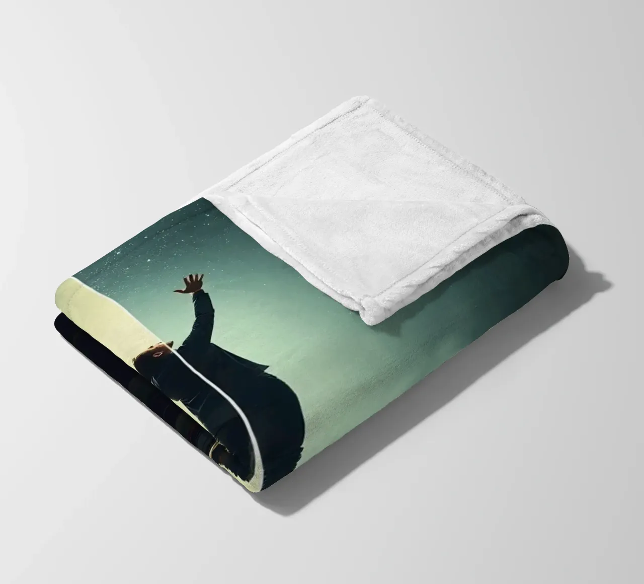 man reaches for stars while standing on a stack of books fleece blanket by DesignDoodle