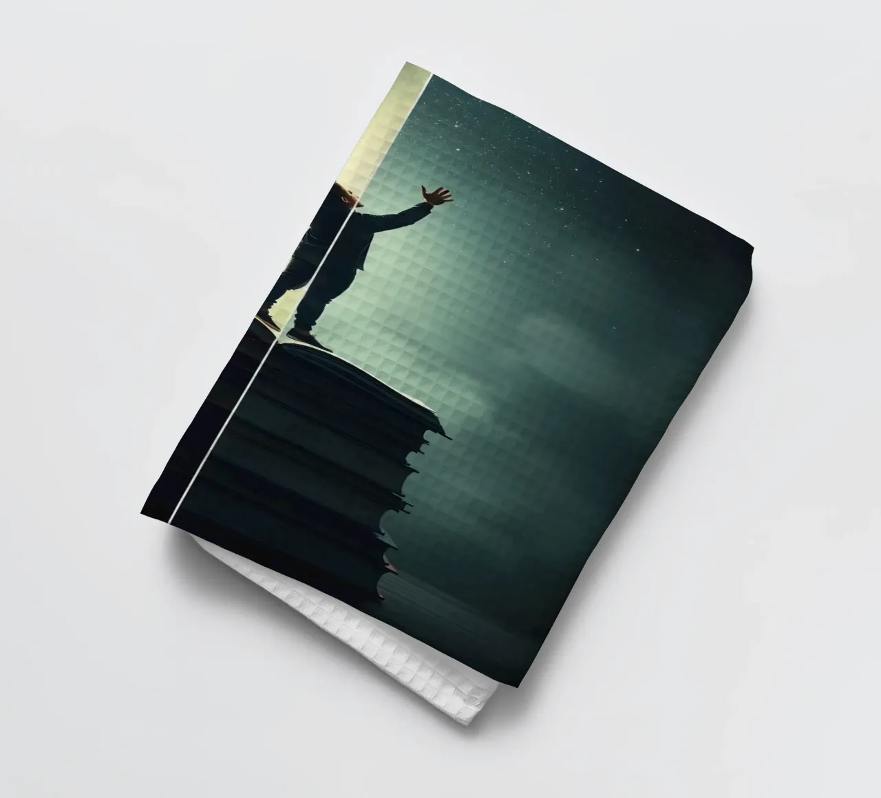 man reaches for stars while standing on a stack of books tea towel by DesignDoodle