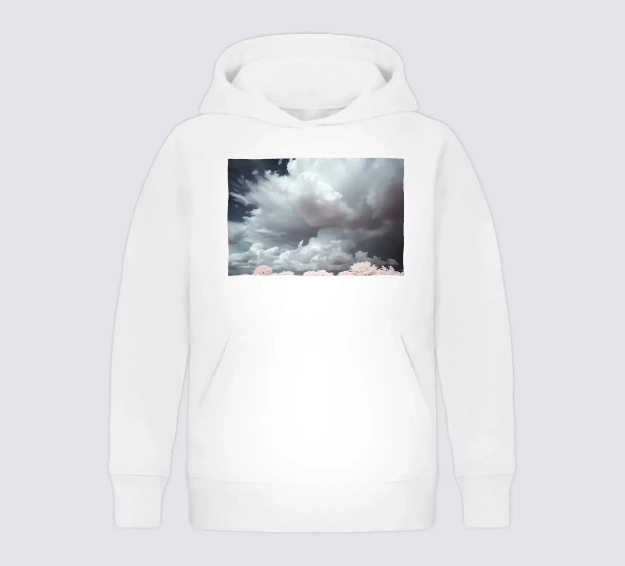 Dramatic clouds hover over pink-tinted trees in an enchantin kids hoodie by DesignDoodle