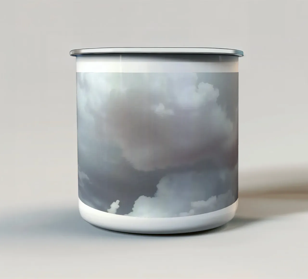 Dramatic clouds hover over pink-tinted trees in an enchantin enamel mug by DesignDoodle