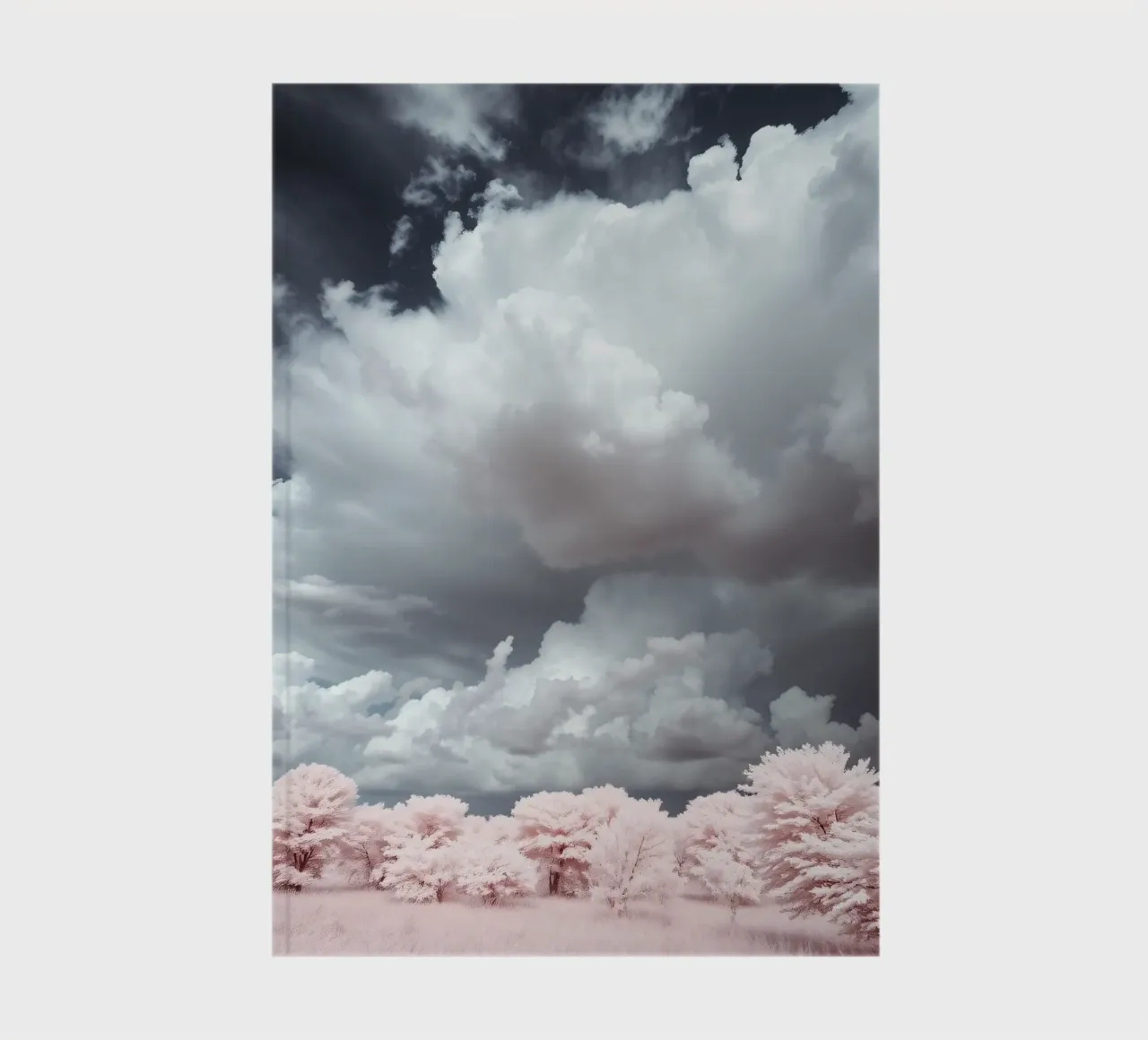 Dramatic clouds hover over pink-tinted trees in an enchantin notebook by DesignDoodle