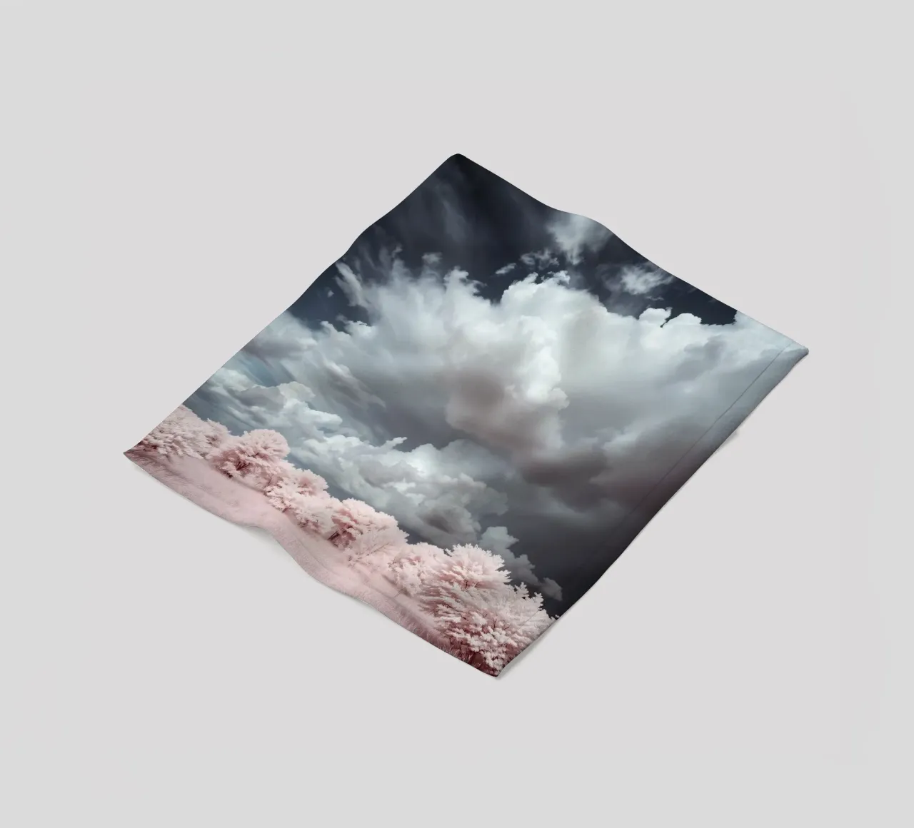 Dramatic clouds hover over pink-tinted trees in an enchantin fleece blanket by DesignDoodle