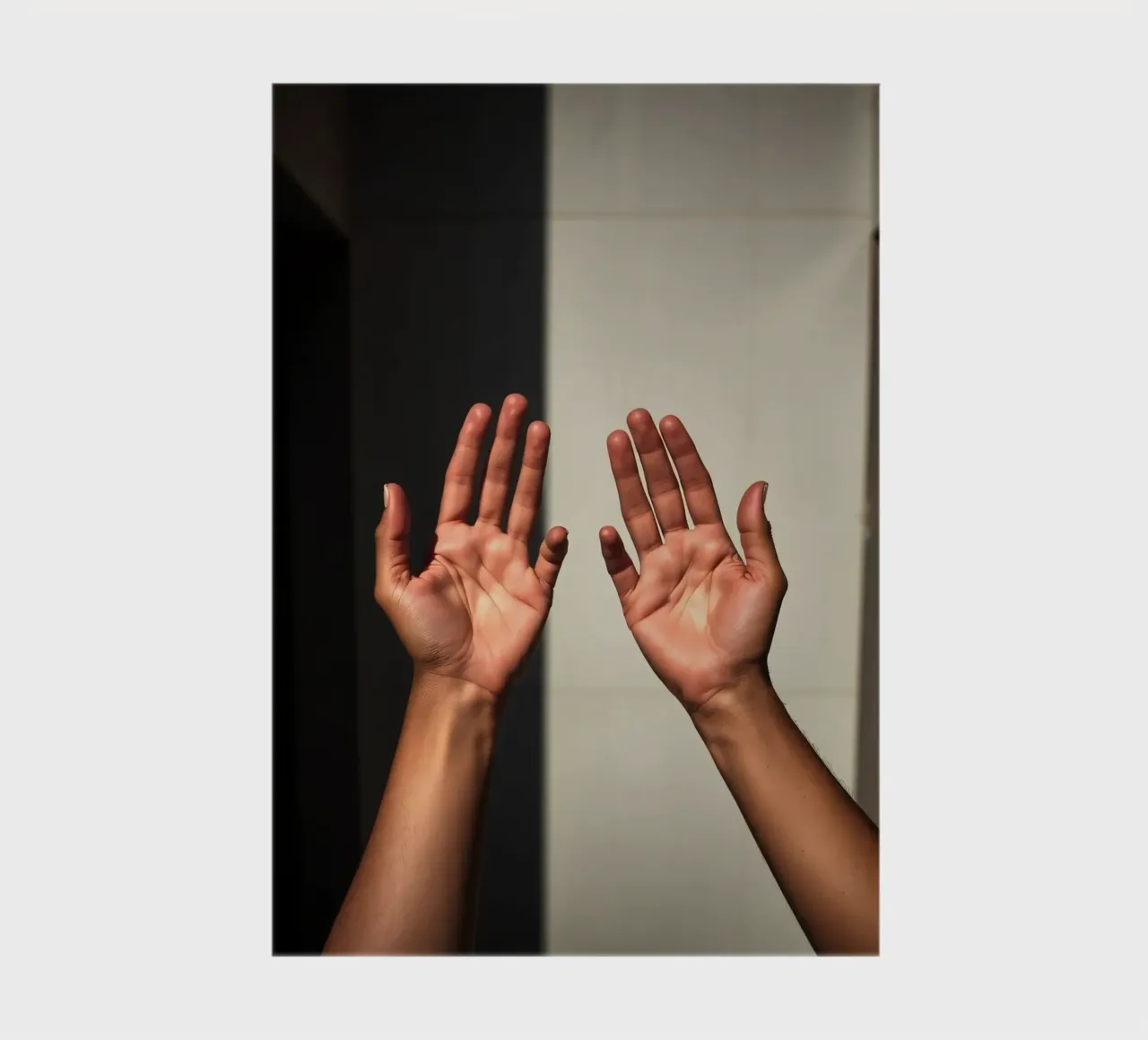 Hands reaching towards light in a minimalist setting notebook by DesignDoodle