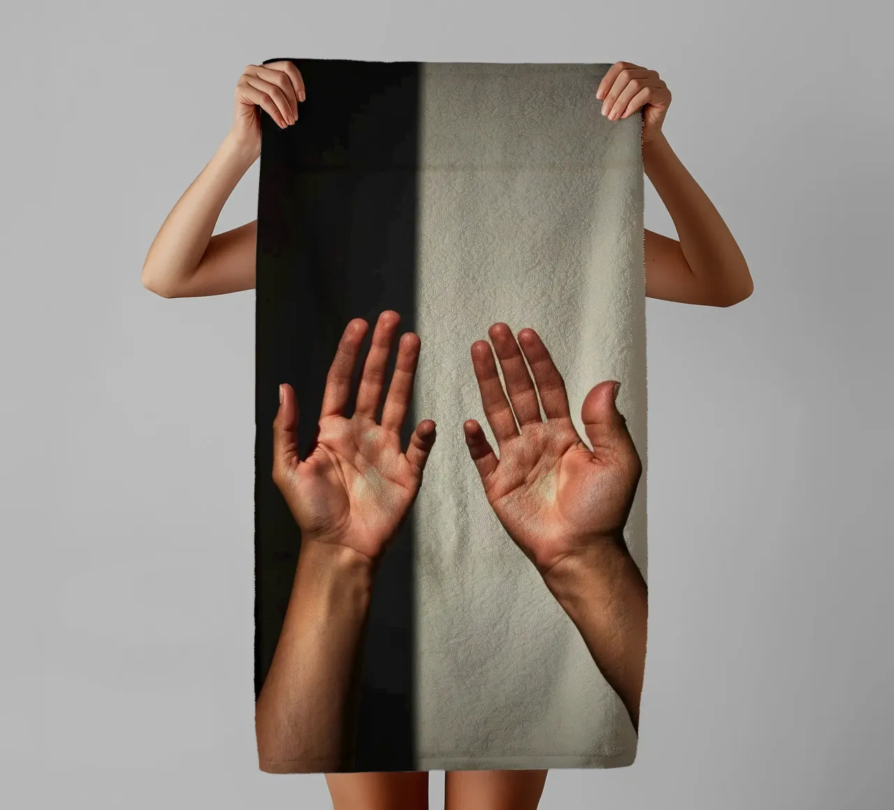 Hands reaching towards light in a minimalist setting towel by DesignDoodle
