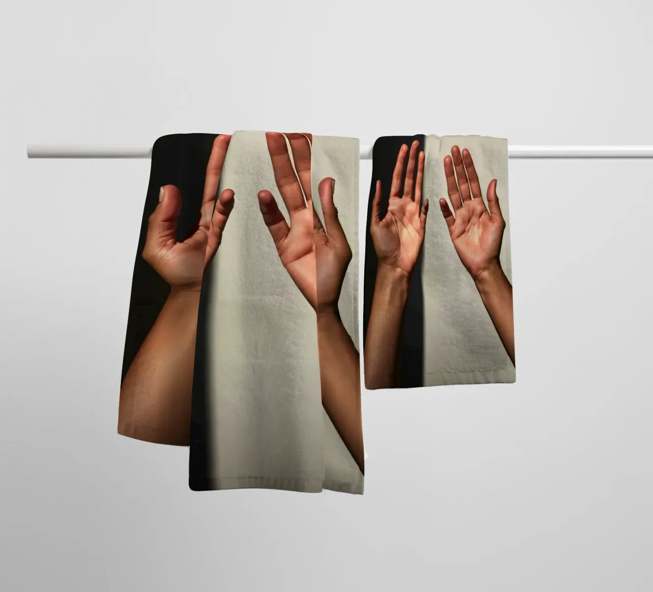 Hands reaching towards light in a minimalist setting towel by DesignDoodle