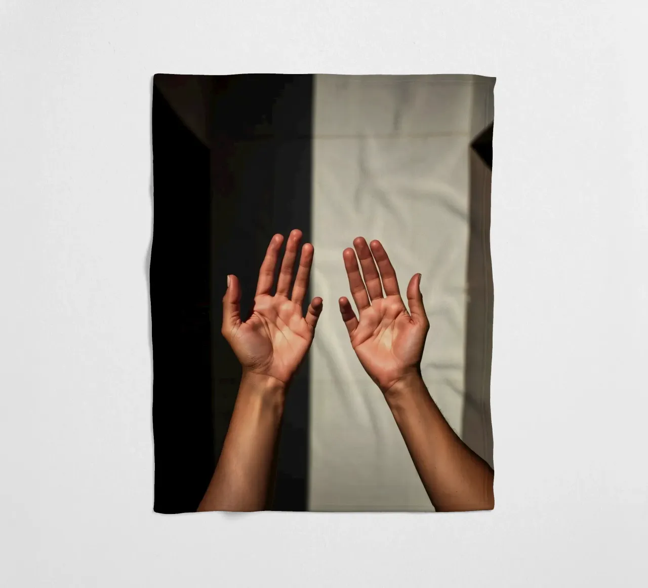Hands reaching towards light in a minimalist setting fleece blanket by DesignDoodle